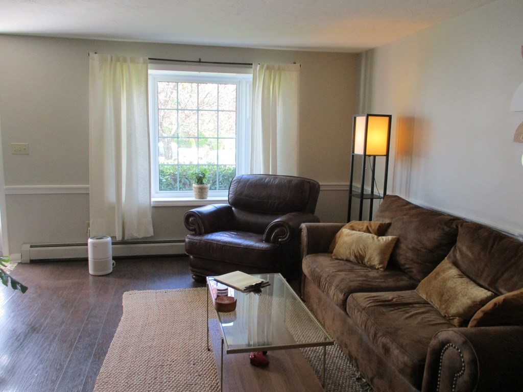 2 Tuck Farm Road, Unit 5 Auburn, MA 01501 - Photo 3 of 11 a living room with furniture and a window