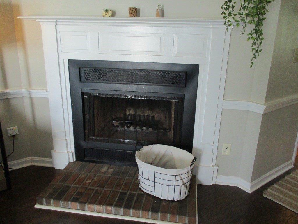 2 Tuck Farm Road, Unit 5 Auburn, MA 01501 - Photo 4 of 11 a room with a fireplace and a table