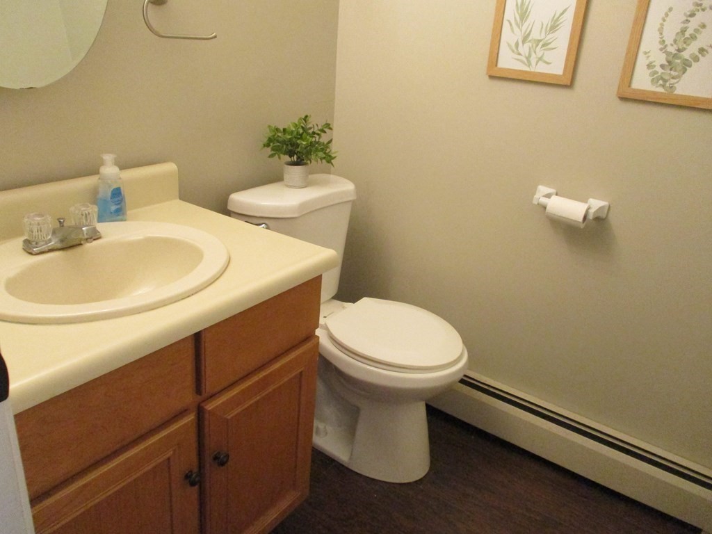 2 Tuck Farm Road, Unit 5 Auburn, MA 01501 - Photo 7 of 11 a bathroom with a sink a toilet and a mirror