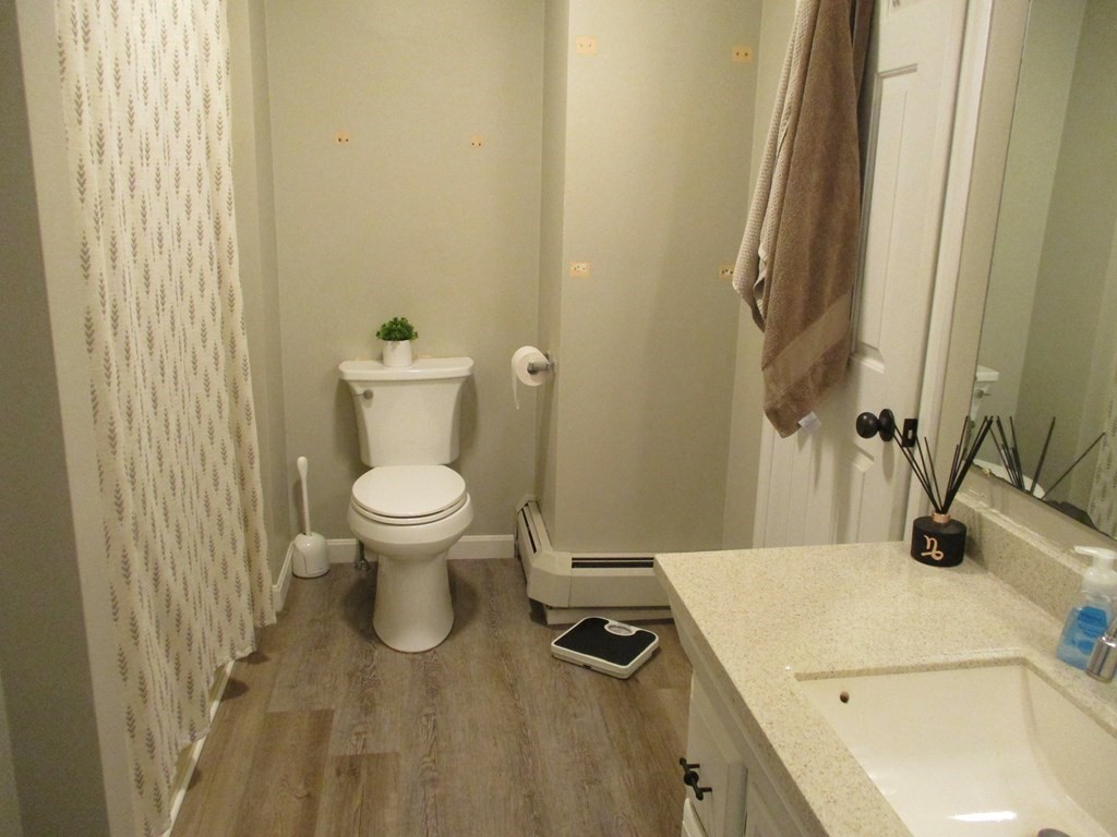 2 Tuck Farm Road, Unit 5 Auburn, MA 01501 - Photo 9 of 11 a bathroom with a sink and a toilet