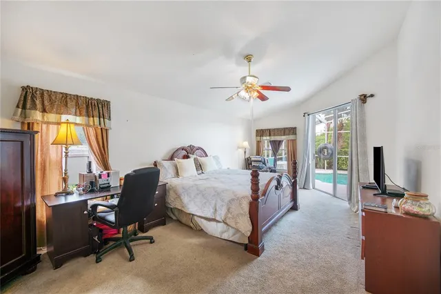 a bed room with a bed and a desk