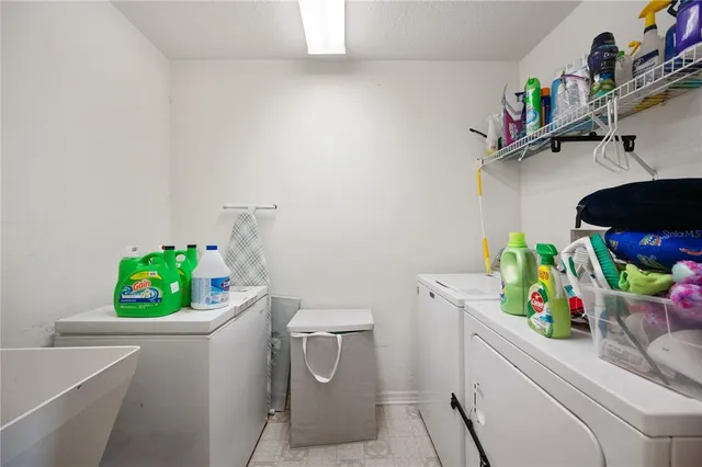 a bathroom with a sink a toilet and a shower