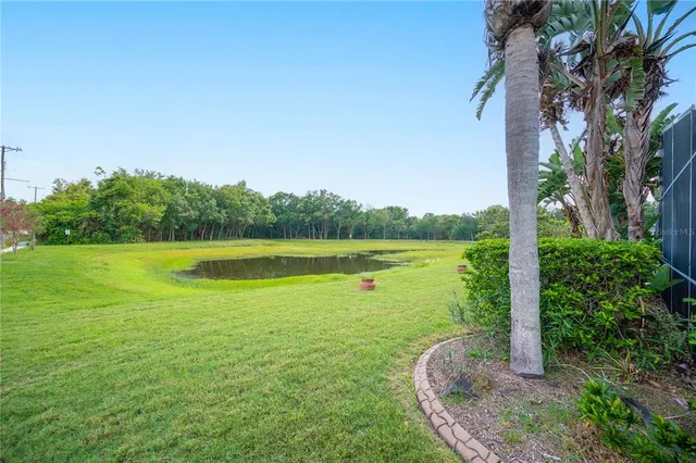 a view of a lake with a big yard