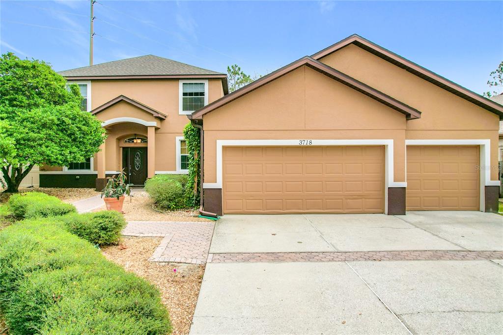 3718 Winners Court Gotha, FL 34734 - Photo 1 of 1 a front view of house with garage