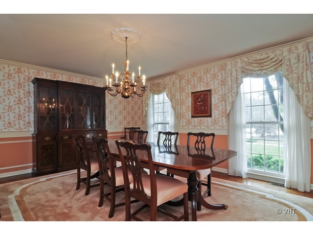 721 Rockefeller Road Lake Forest, IL 60045 - Photo 5 of 10 a view of a dining room with furniture and chandelier