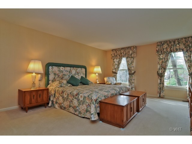 721 Rockefeller Road Lake Forest, IL 60045 - Photo 8 of 10 a bedroom with bed and window