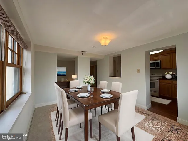a view of a dining room with furniture and window