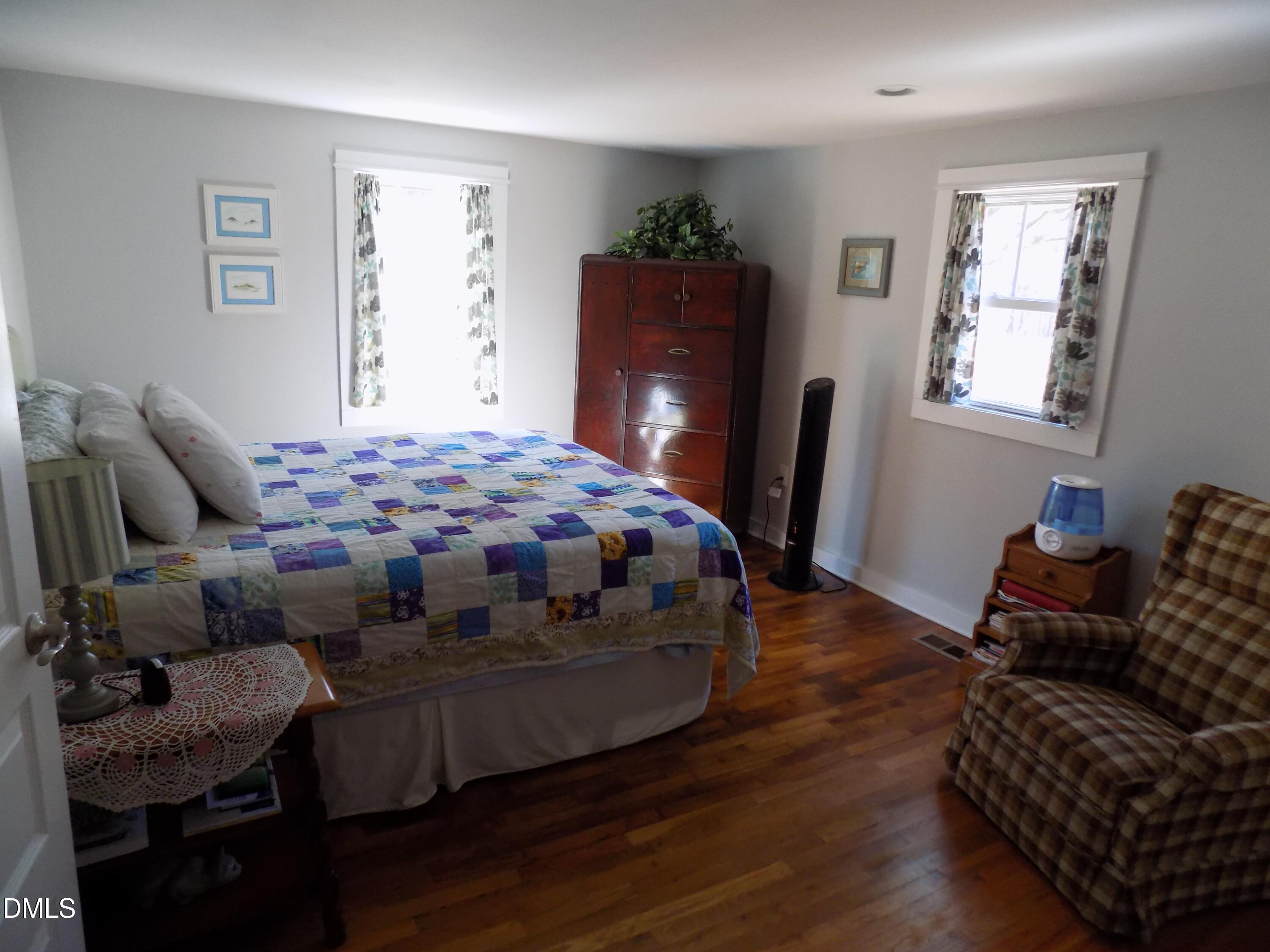 15 Full Circle Spring Hope, NC 27882 - Photo 18 of 51 a bedroom with bed and wooden floor
