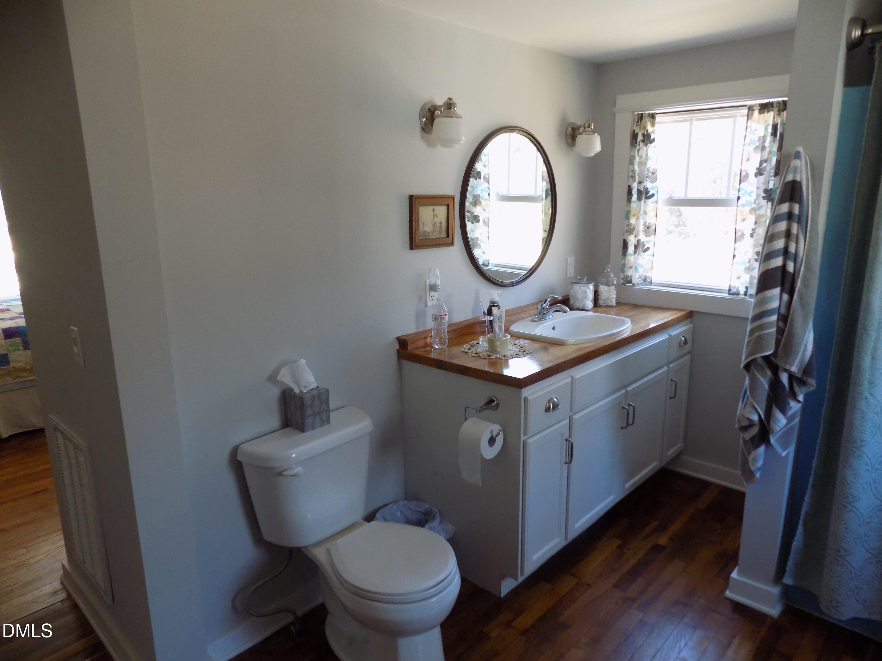 15 Full Circle Spring Hope, NC 27882 - Photo 19 of 51 a bathroom with a toilet a sink and a mirror