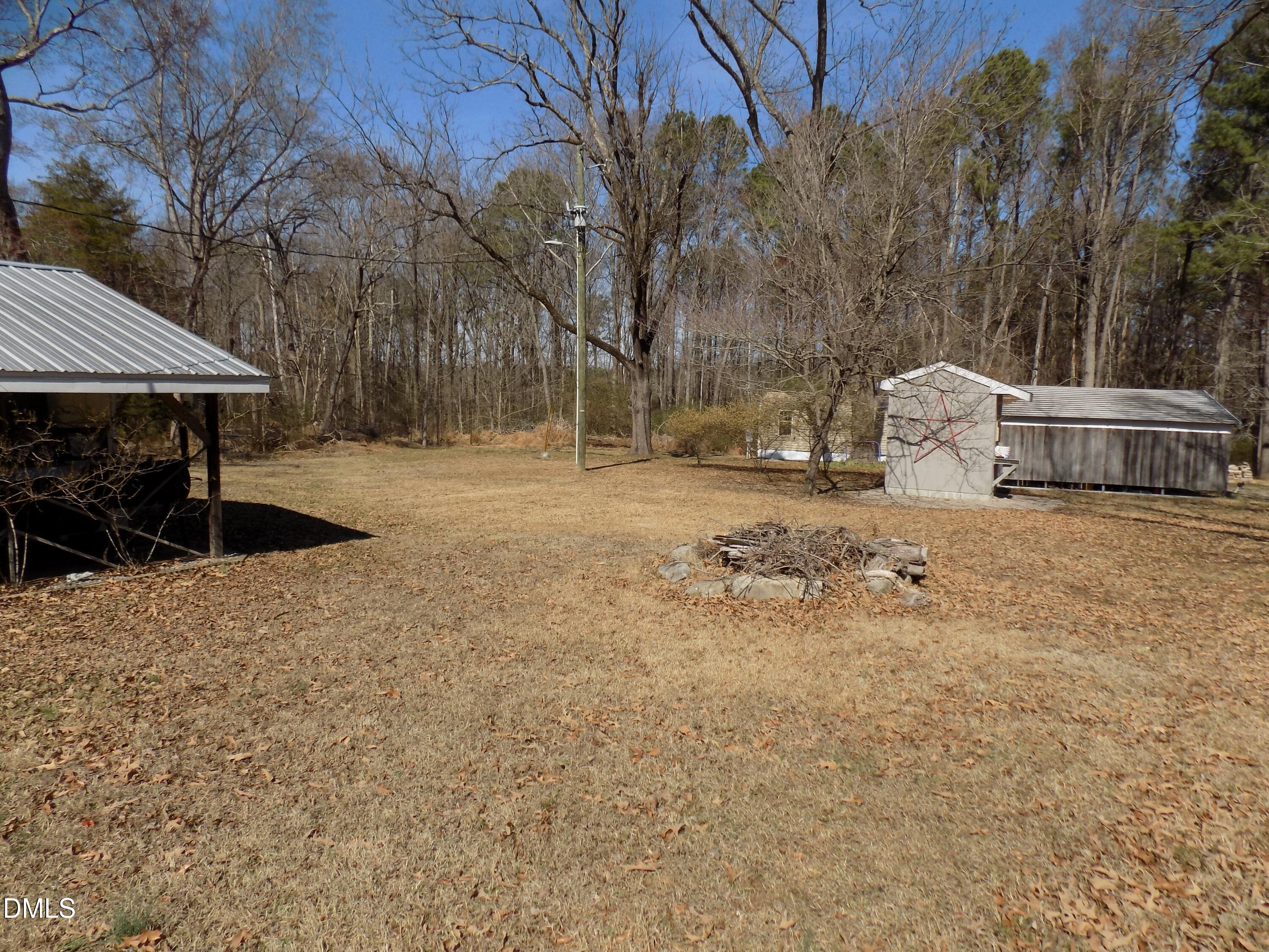 15 Full Circle Spring Hope, NC 27882 - Photo 26 of 51 a backyard of a house with table and chairs