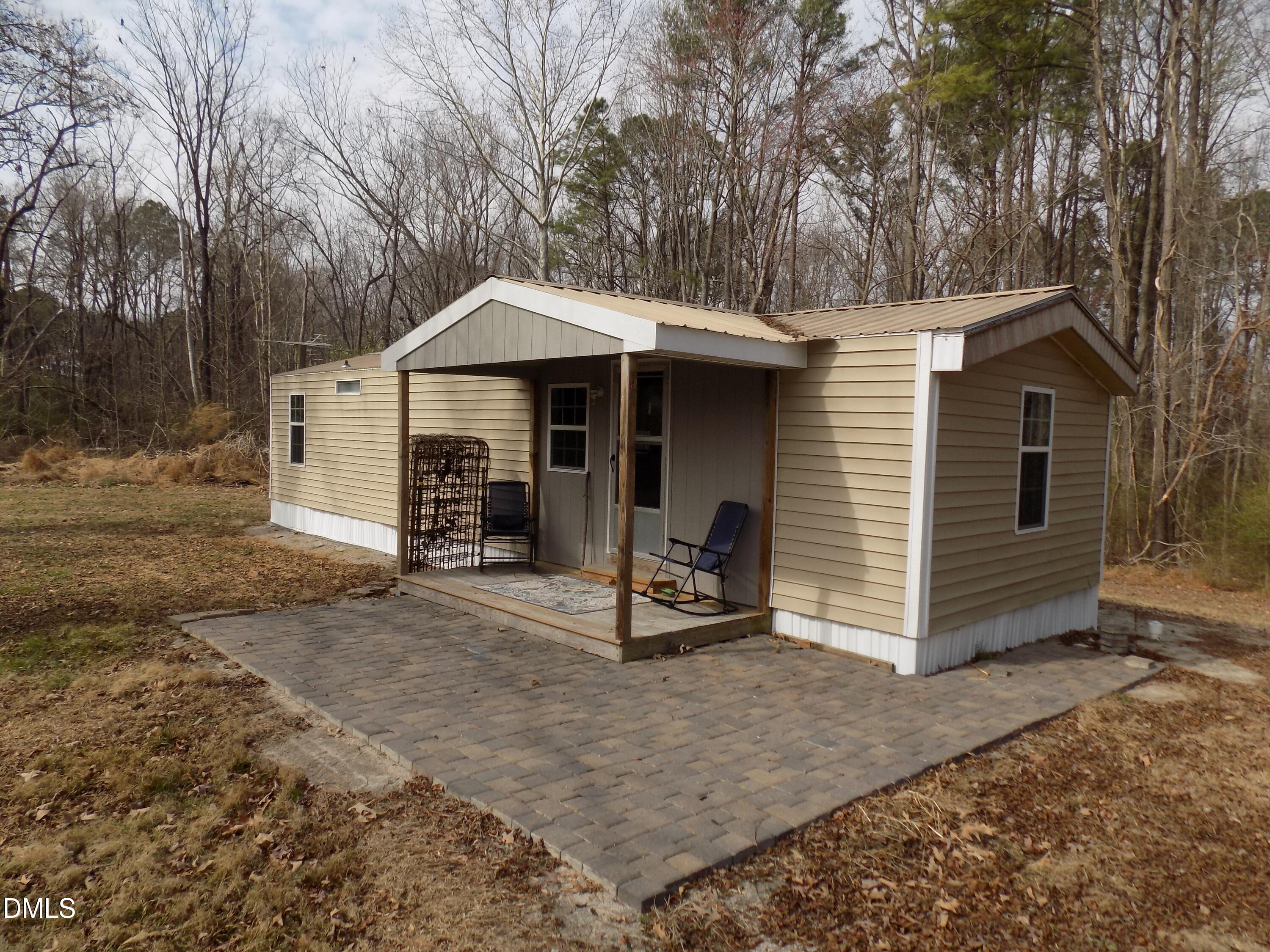 15 Full Circle Spring Hope, NC 27882 - Photo 29 of 51 a view of a chair and table in the back yard