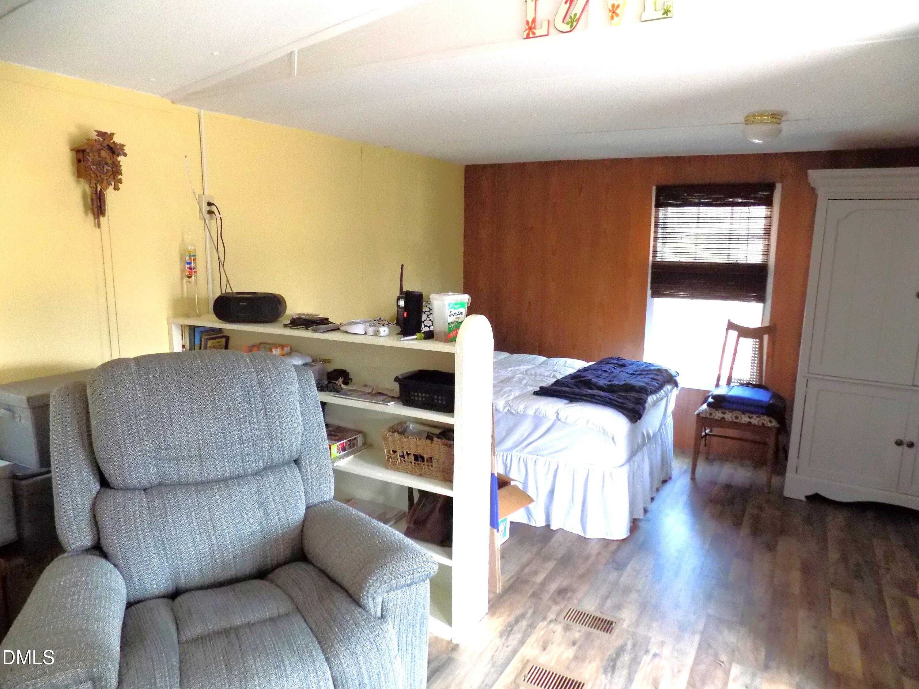 15 Full Circle Spring Hope, NC 27882 - Photo 33 of 51 a living room with furniture and a wooden floor