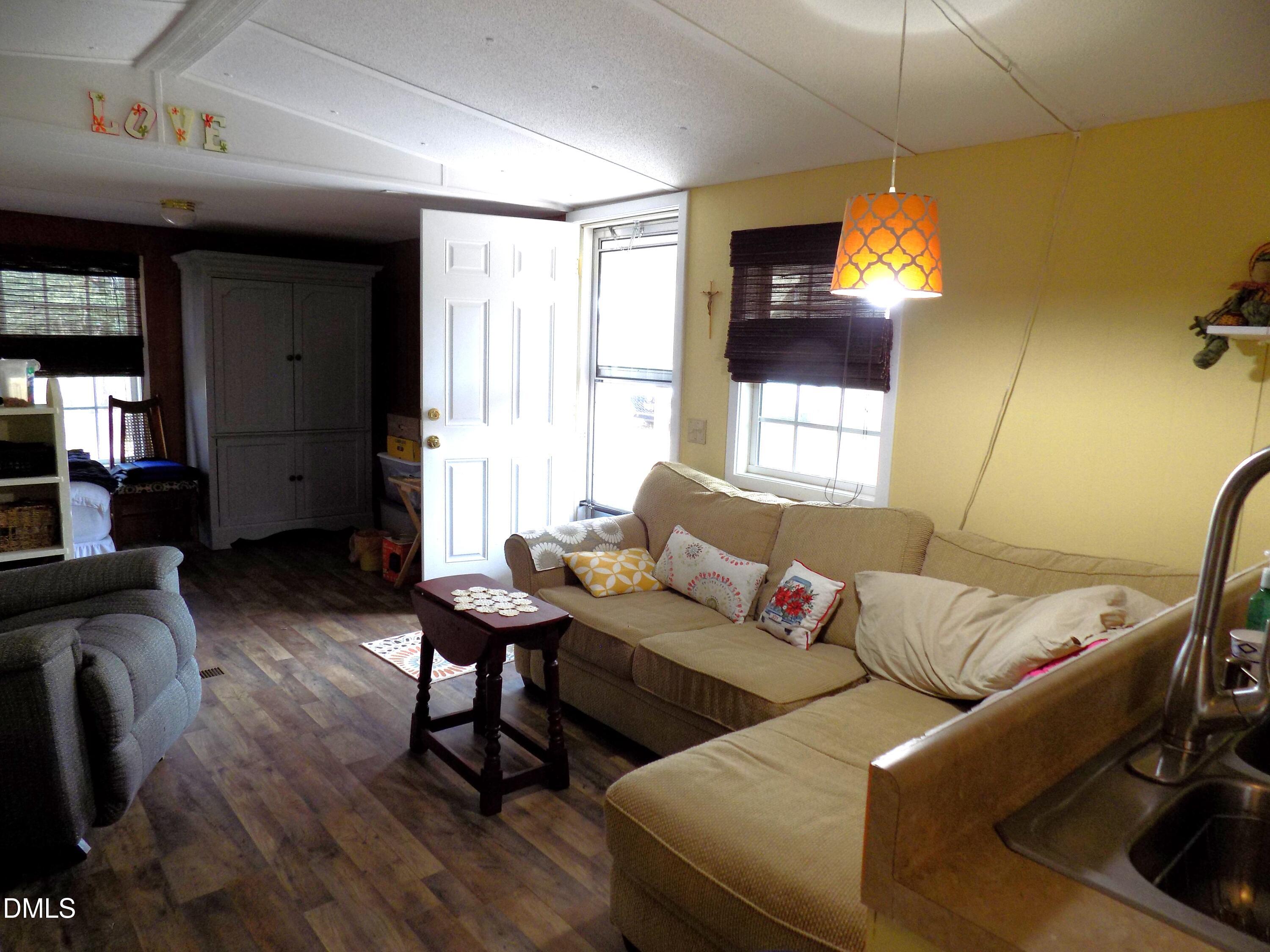 15 Full Circle Spring Hope, NC 27882 - Photo 35 of 51 a living room with furniture and a flat screen tv
