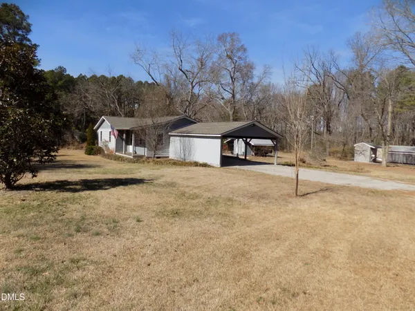 a house with trees in the background