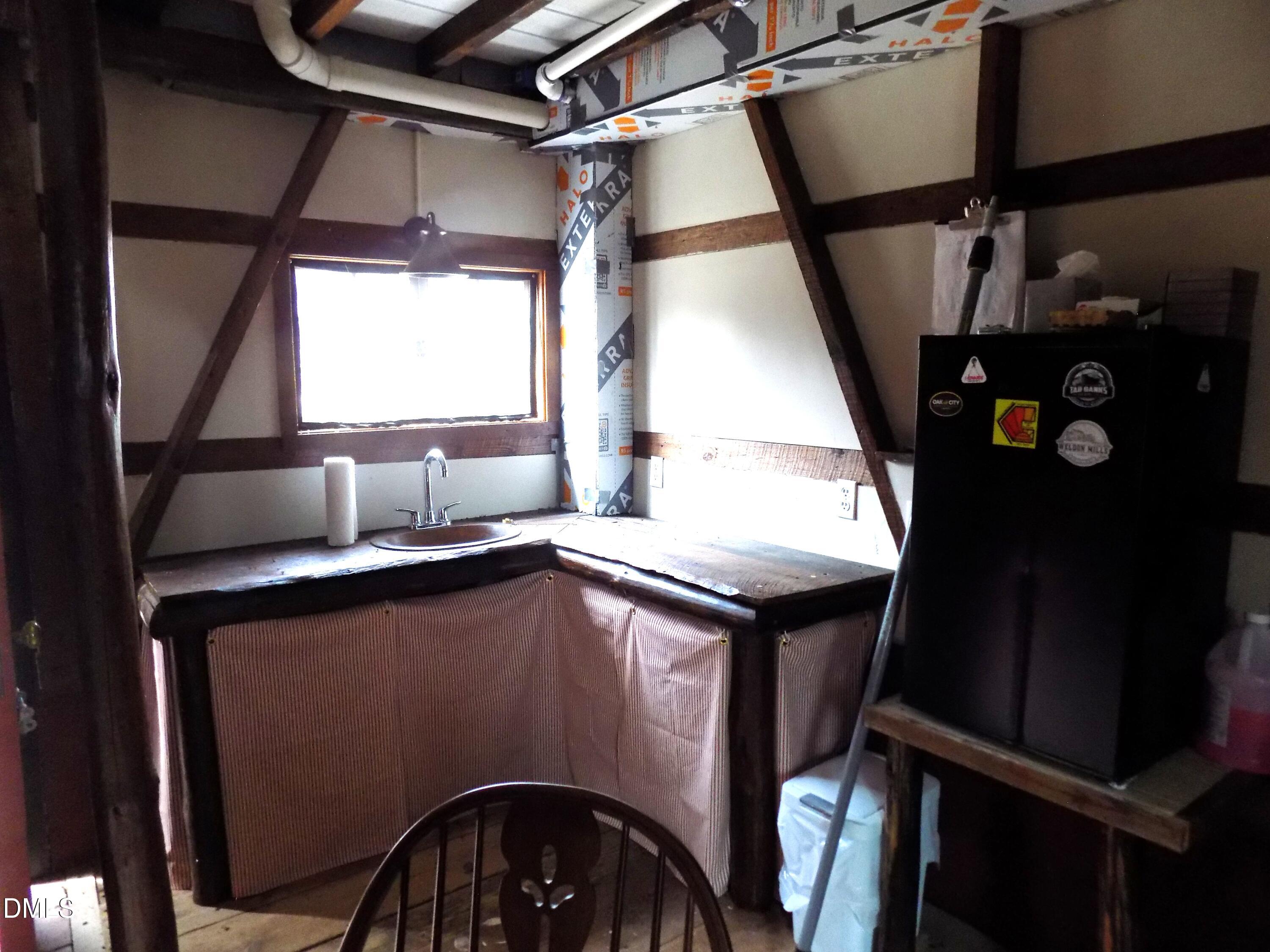 15 Full Circle Spring Hope, NC 27882 - Photo 45 of 51 a kitchen with a sink a refrigerator and window