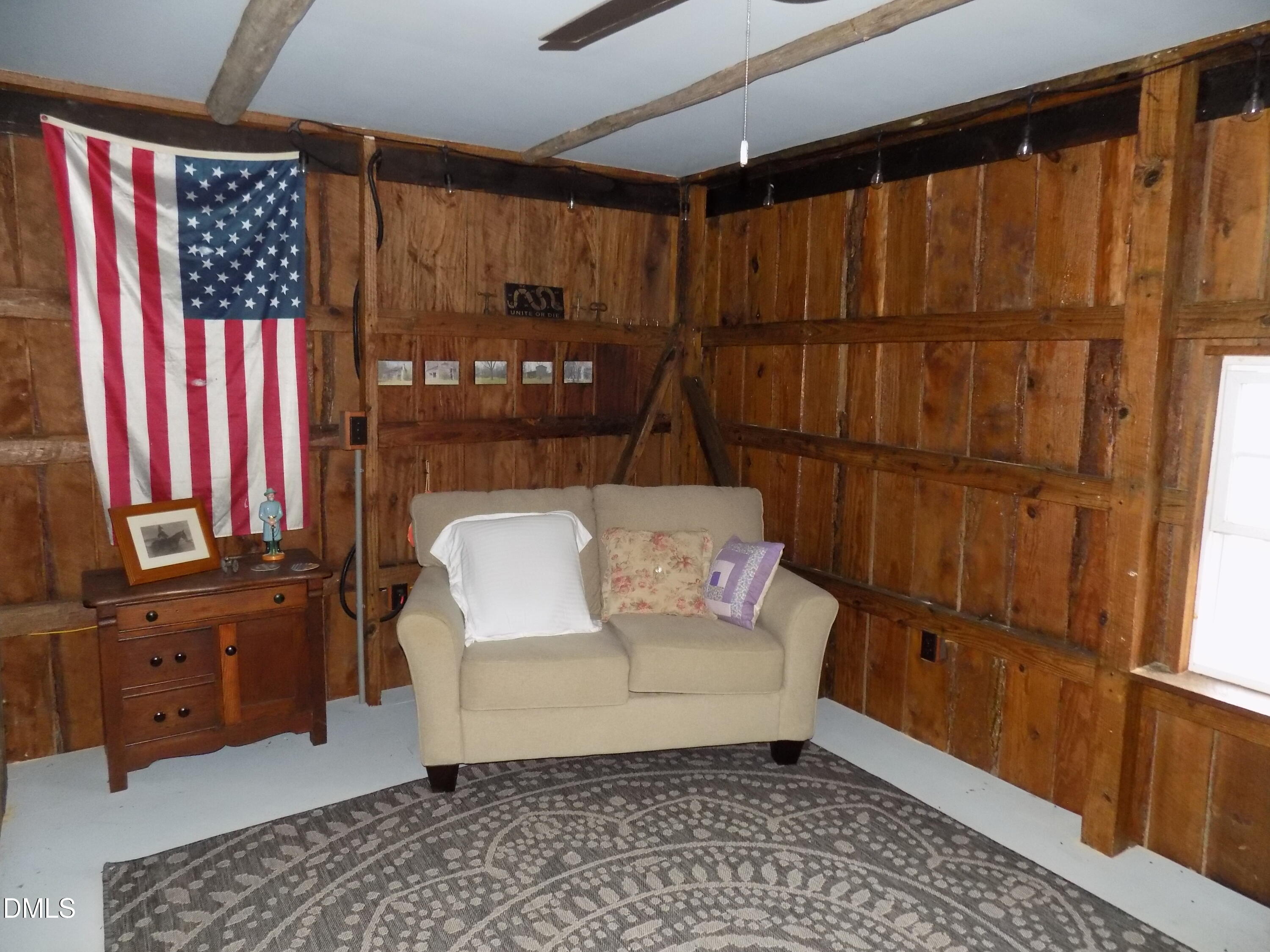 15 Full Circle Spring Hope, NC 27882 - Photo 48 of 51 a living room with a couch and dresser with wooden floor