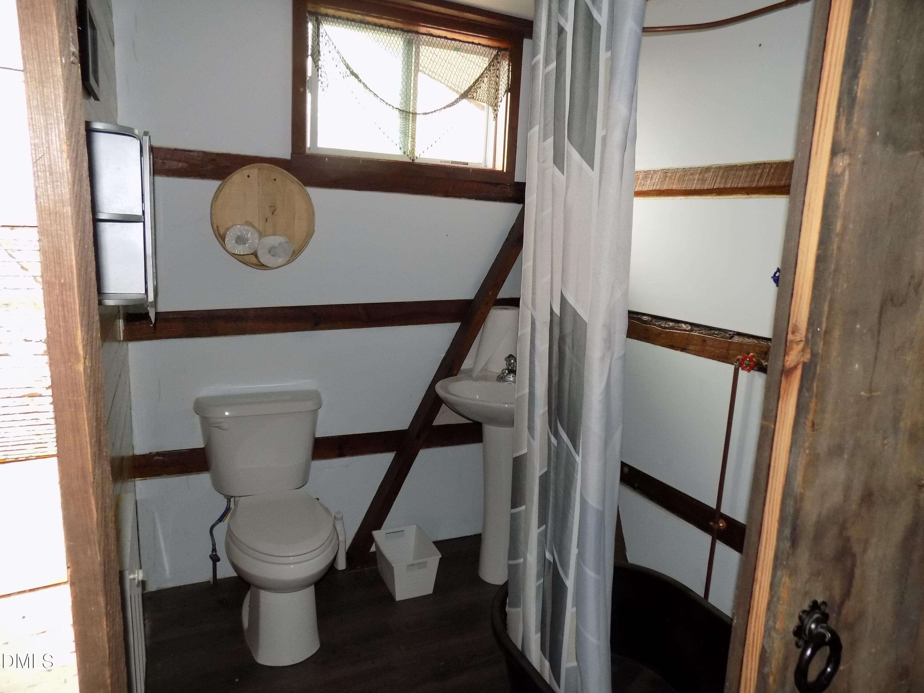15 Full Circle Spring Hope, NC 27882 - Photo 50 of 51 a bathroom with a toilet and a mirror