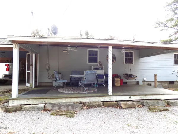 a view of a house with outdoor seating