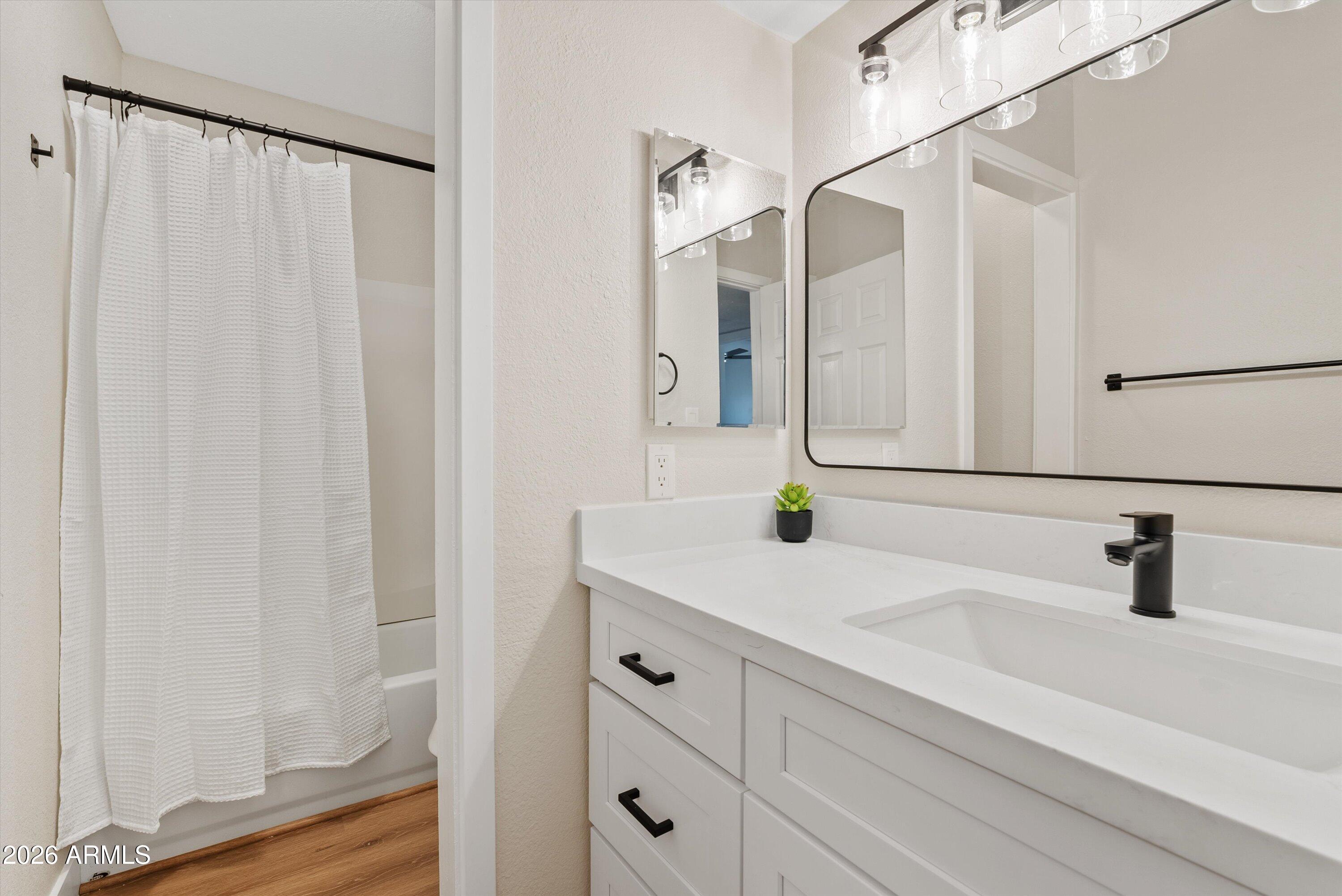 720 South Dobson Road, Unit 55 Mesa, AZ 85202 - Photo 13 of 33 a bathroom with a sink and a mirror