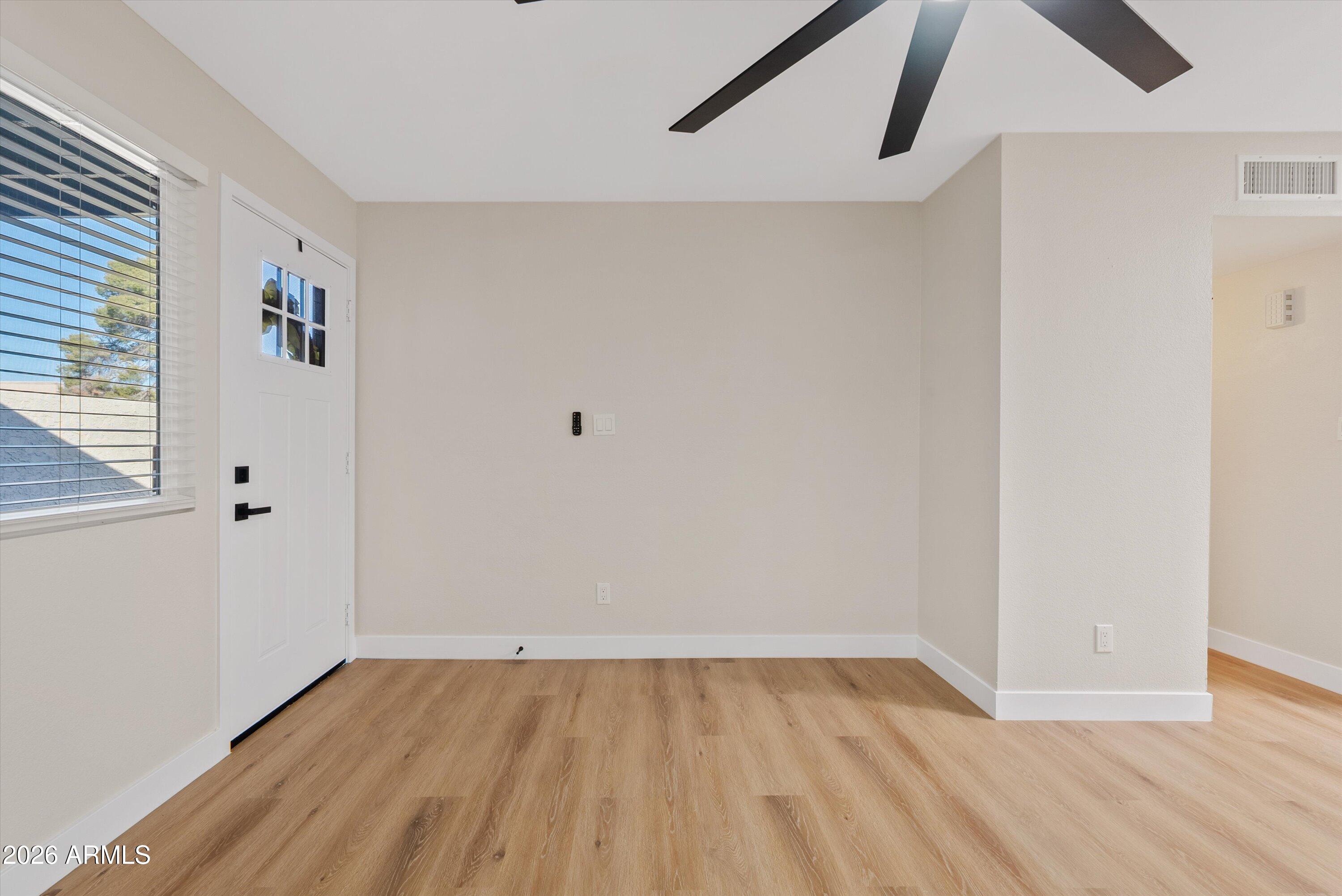 720 South Dobson Road, Unit 55 Mesa, AZ 85202 - Photo 5 of 33 wooden floor in an empty room