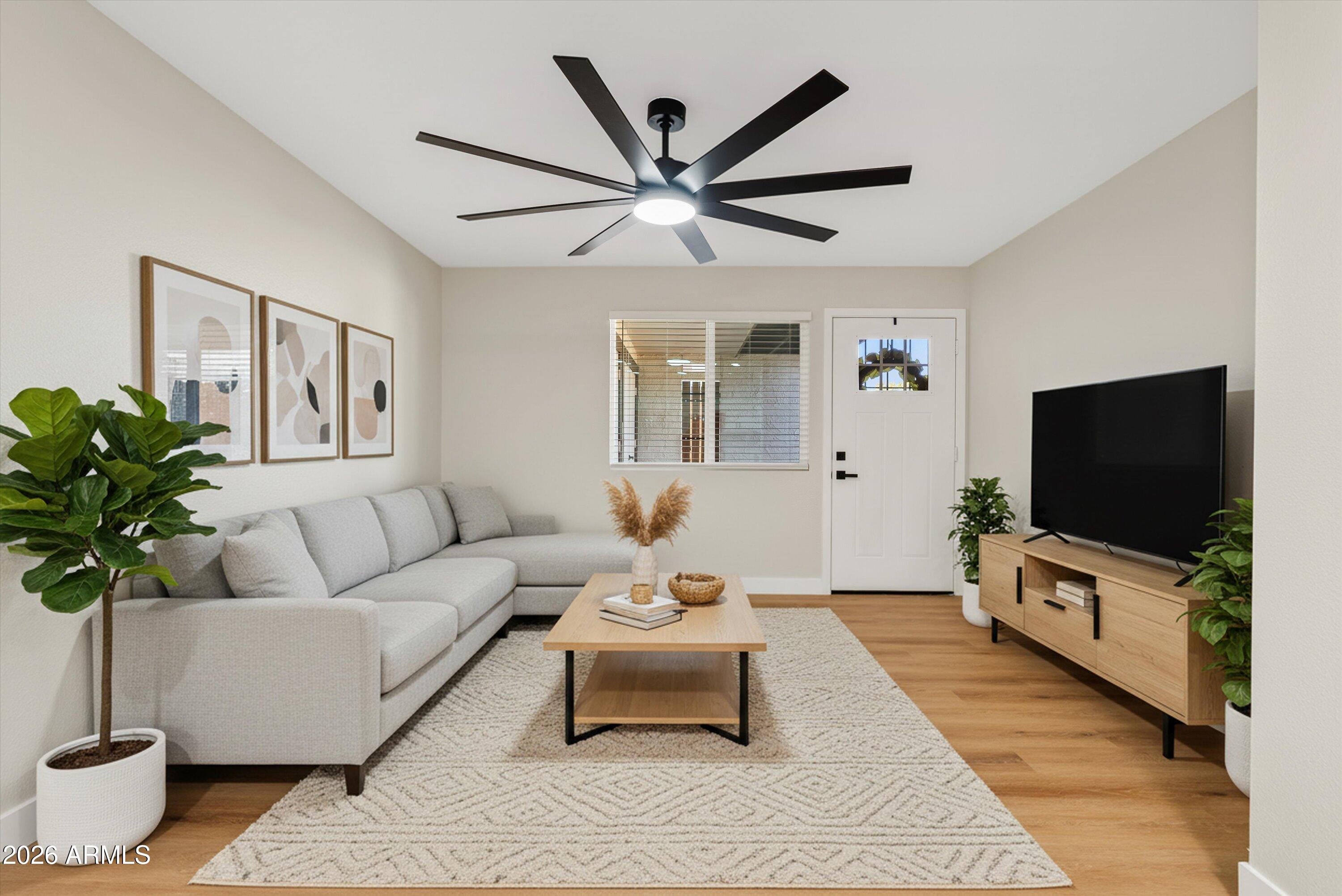 720 South Dobson Road, Unit 55 Mesa, AZ 85202 - Photo 6 of 33 a living room with furniture and a flat screen tv