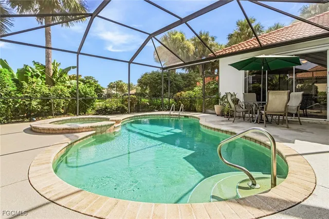 a view of a swimming pool with a patio