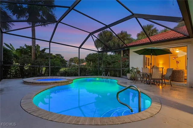 a view of a swimming pool with a yard