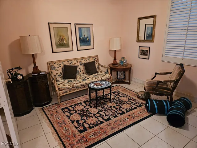 a living room with furniture and a rug