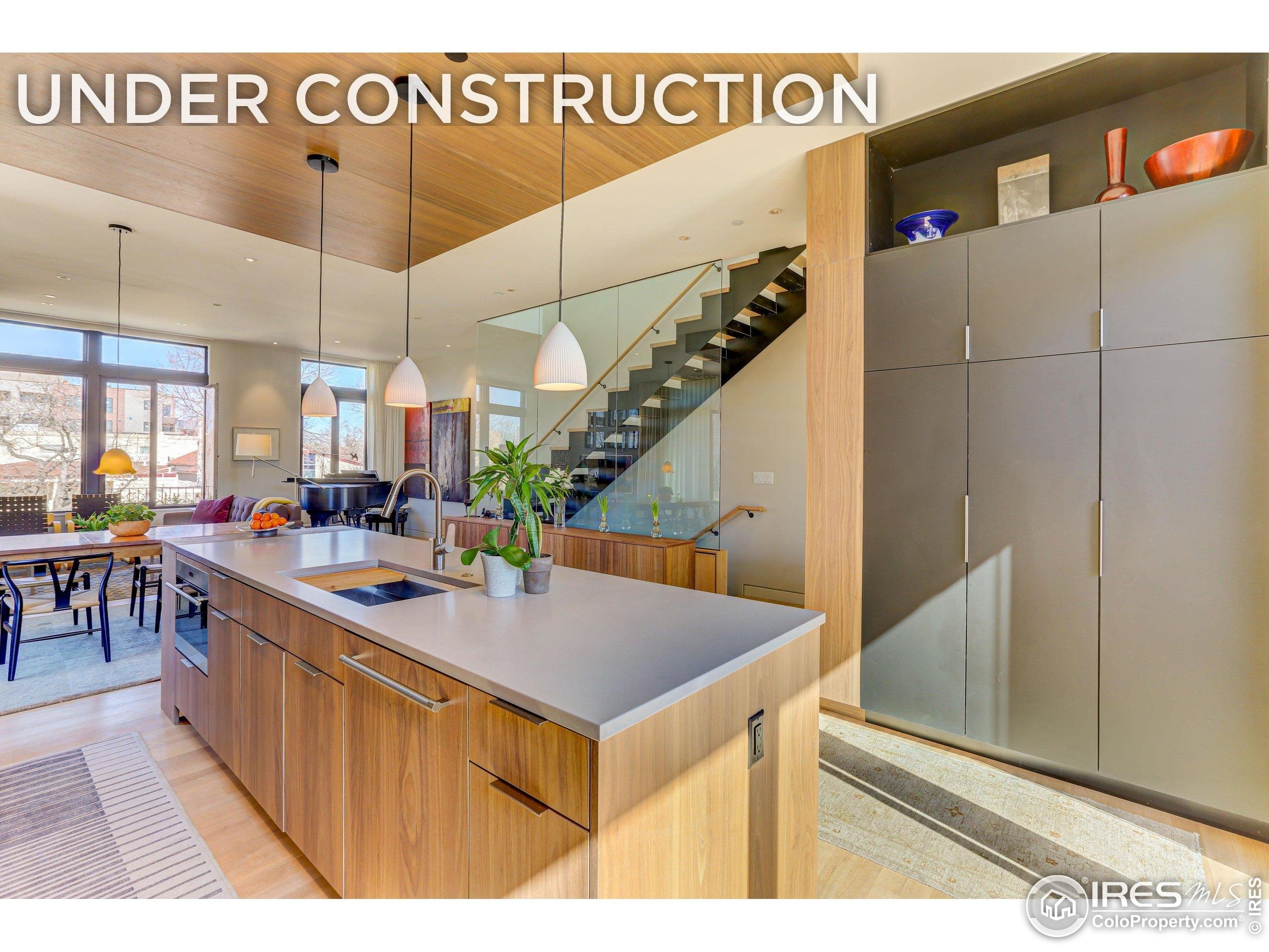 153 Mathews Street, Unit 113A Fort Collins, CO 80524 - Photo 1 of 29 a view of a kitchen and dining room