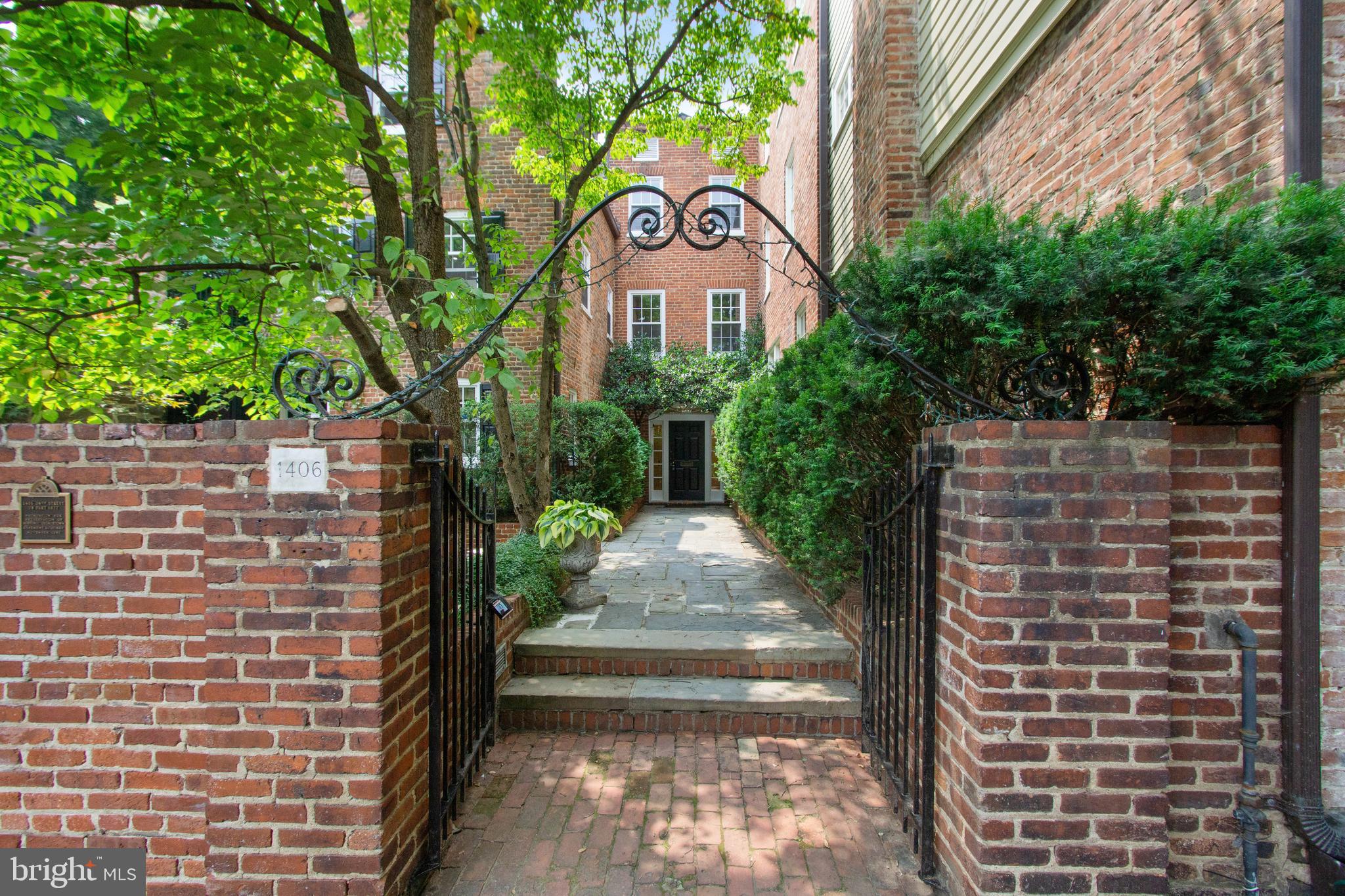1406 34th Street Northwest Washington, DC 20007 - Photo 2 of 45 a front view of a house with garden