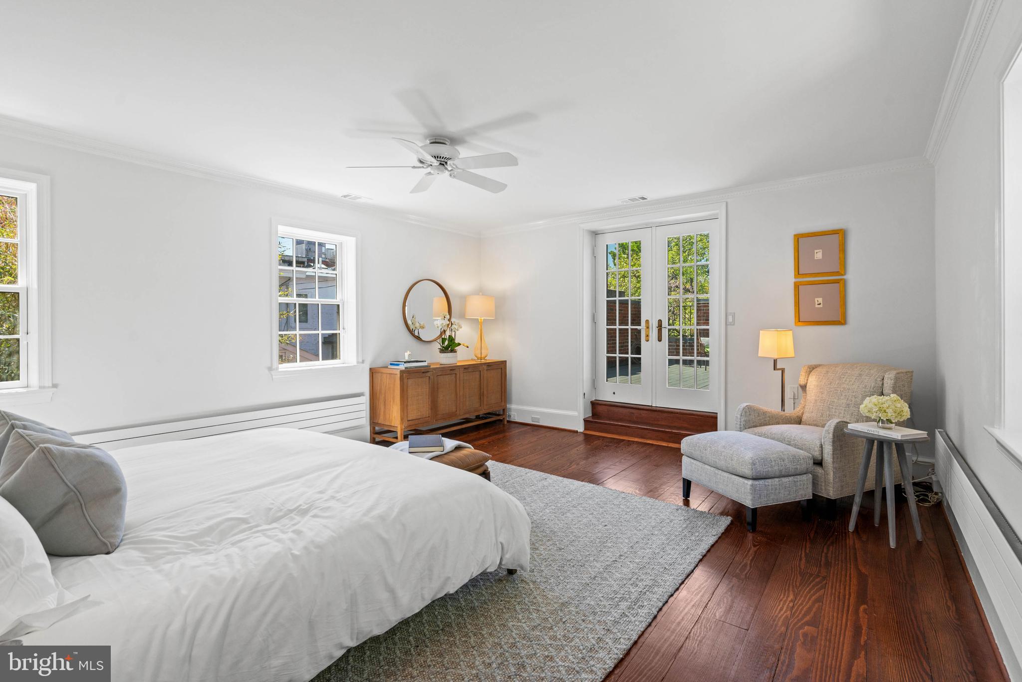 1406 34th Street Northwest Washington, DC 20007 - Photo 21 of 45 a spacious bedroom with a bed wooden floor and window