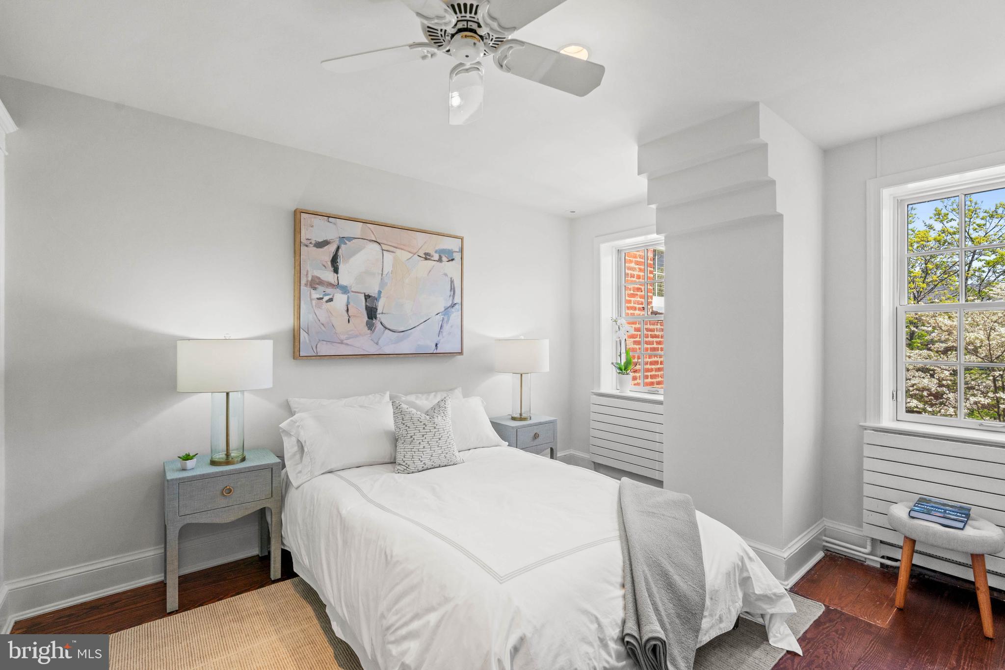 1406 34th Street Northwest Washington, DC 20007 - Photo 28 of 45 a bedroom with a bed and a chandelier