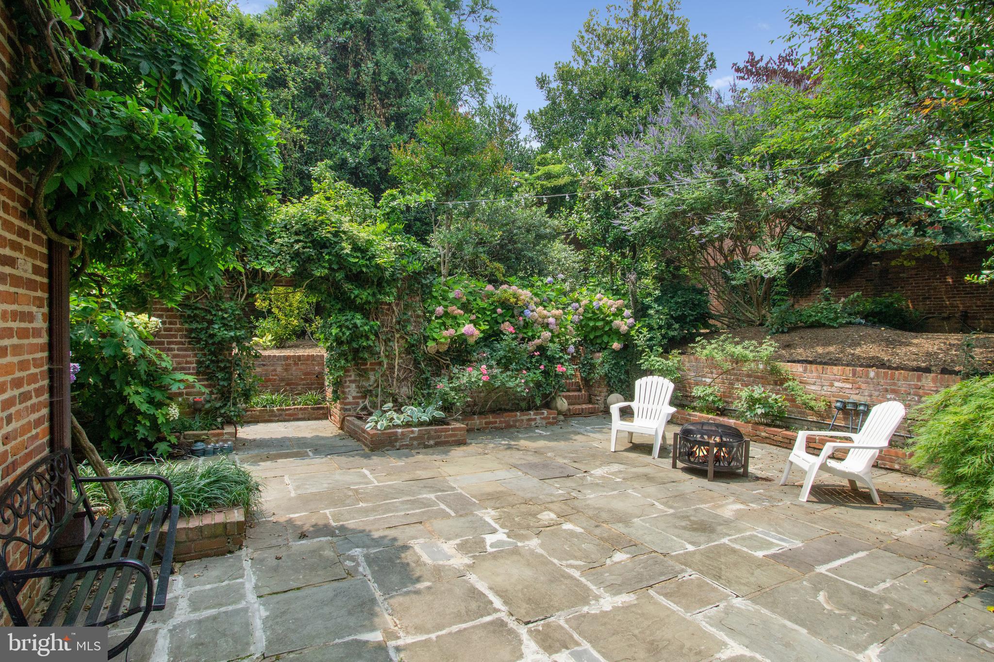 1406 34th Street Northwest Washington, DC 20007 - Photo 35 of 45 a backyard of a house with outdoor seating