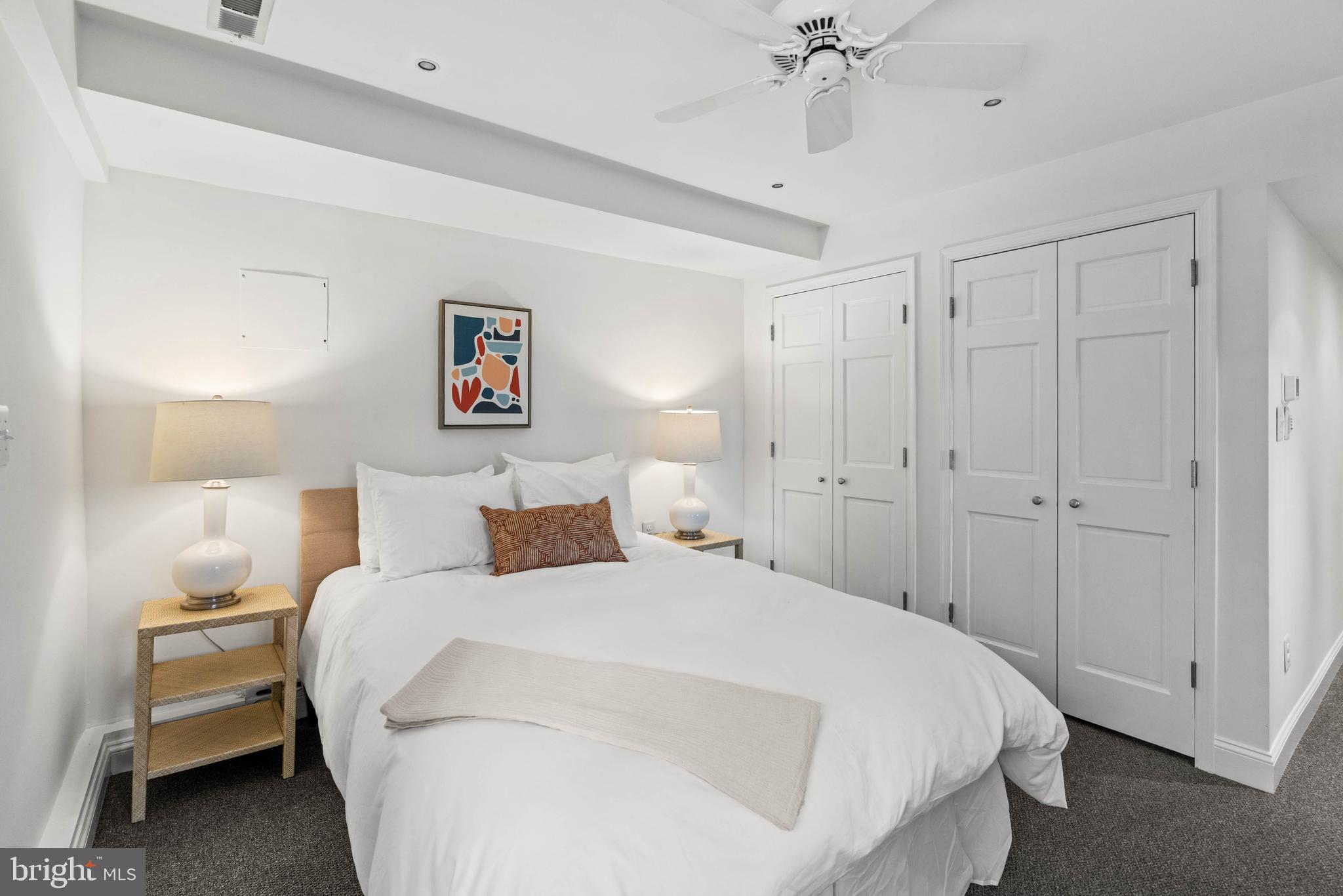 1406 34th Street Northwest Washington, DC 20007 - Photo 5 of 45 a bedroom with a bed and a chandelier