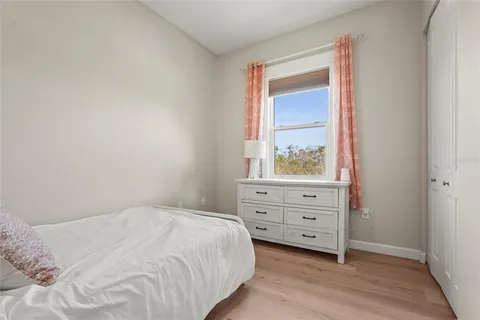 a view of backyard with swimming pool and outdoor seating