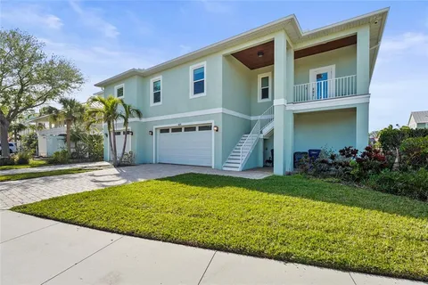 a living room with furniture and a view of kitchen