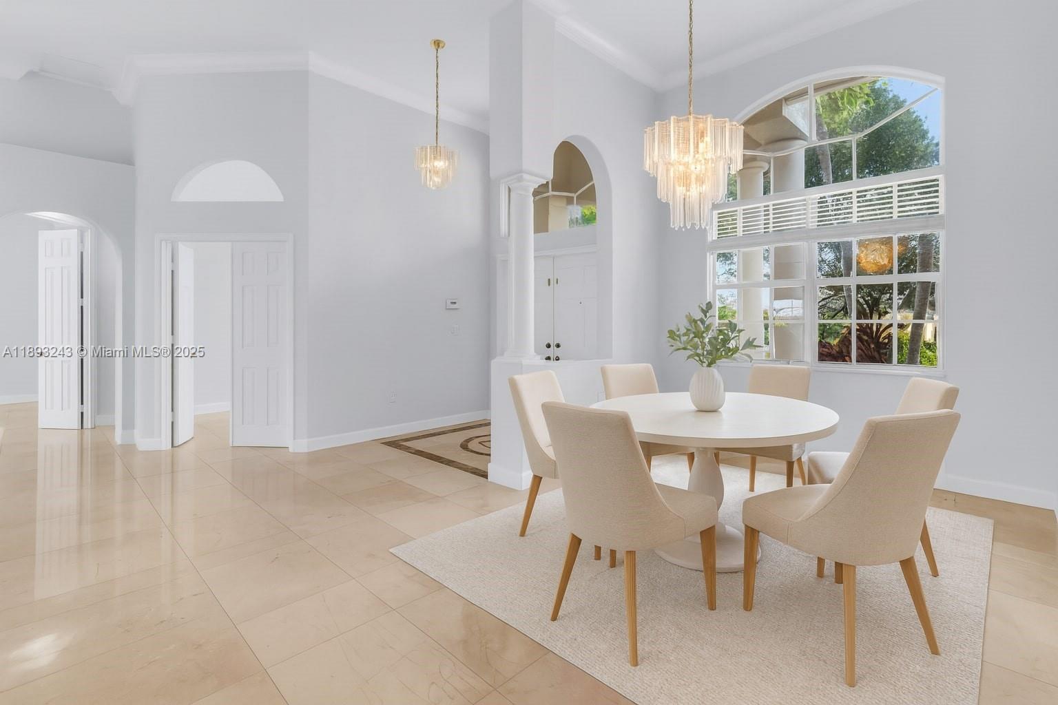 14032 Northwest 15th Street Pembroke Pines, FL 33028 - Photo 14 of 55 a view of a dining room with furniture and chandelier