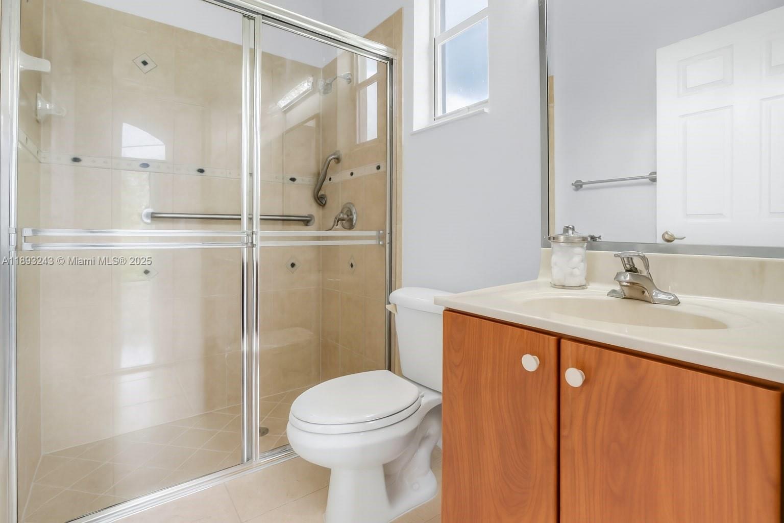 14032 Northwest 15th Street Pembroke Pines, FL 33028 - Photo 17 of 55 a bathroom with a sink a toilet and shower