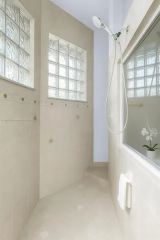 a dining room with furniture and a chandelier