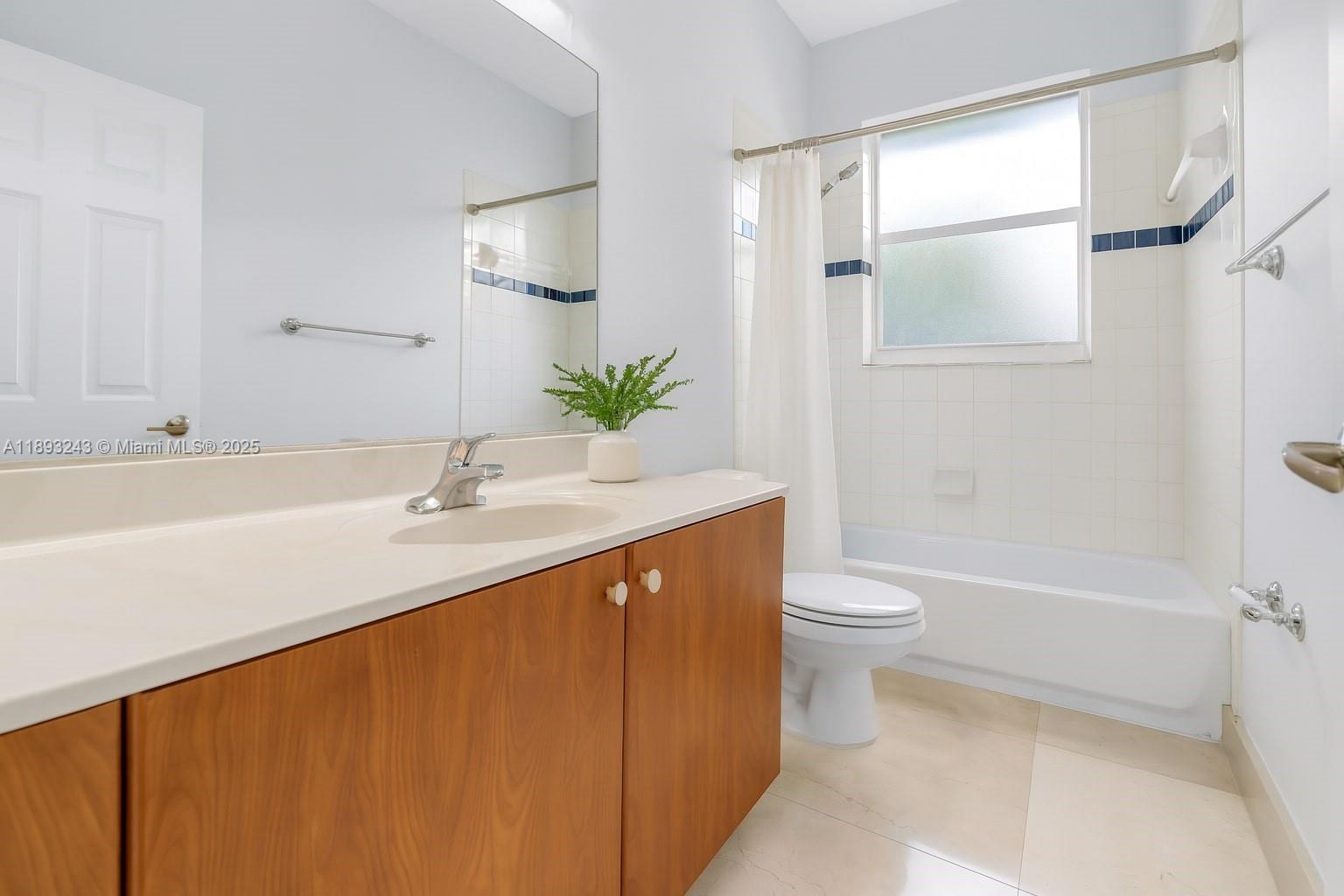 14032 Northwest 15th Street Pembroke Pines, FL 33028 - Photo 19 of 55 a bathroom with a sink a toilet and shower