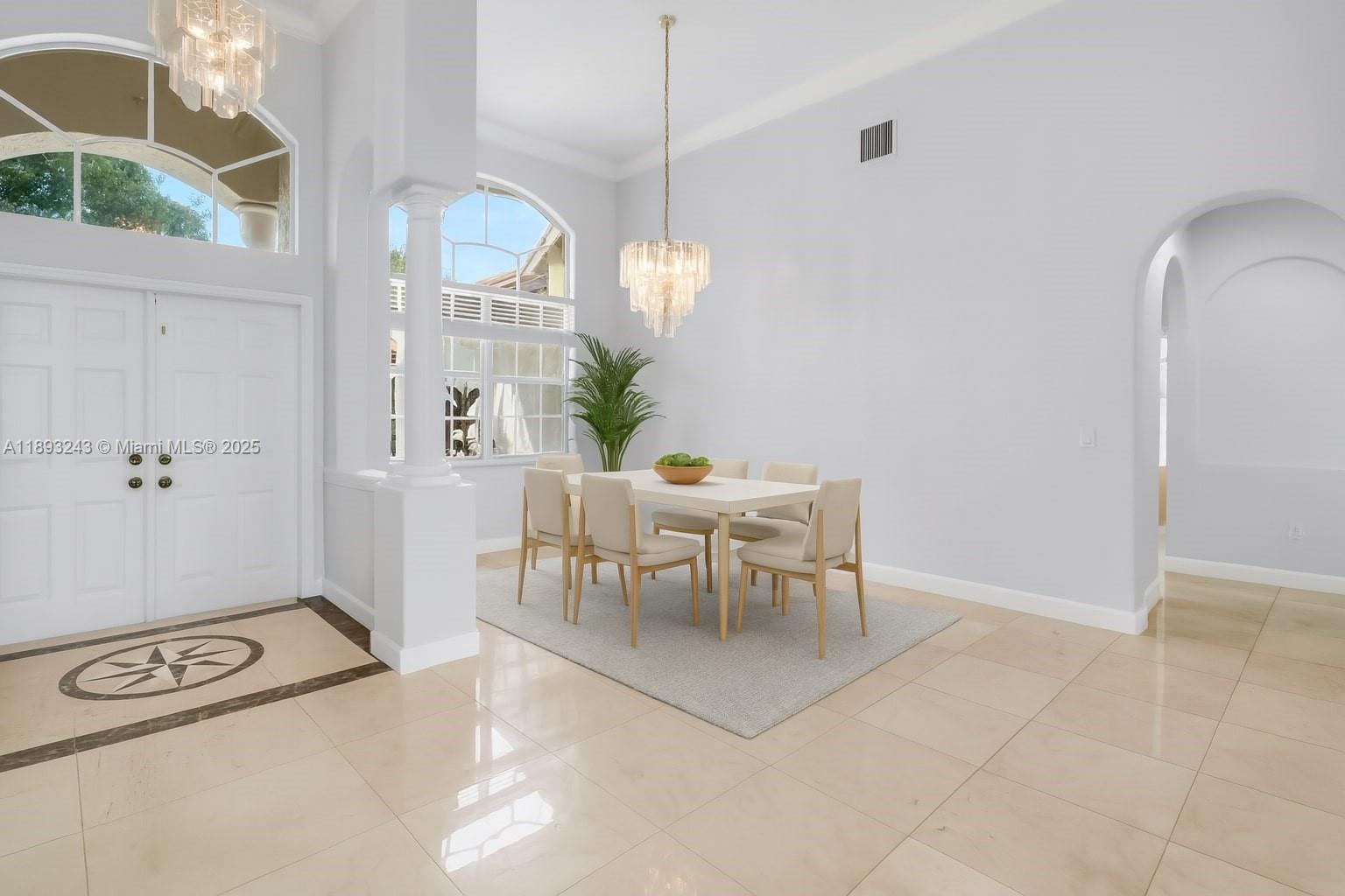14032 Northwest 15th Street Pembroke Pines, FL 33028 - Photo 20 of 55 a dining room with furniture and a chandelier