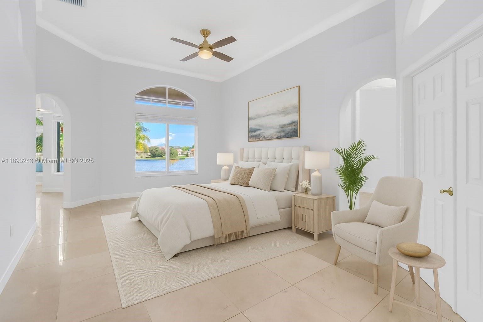 14032 Northwest 15th Street Pembroke Pines, FL 33028 - Photo 21 of 55 a bedroom with a bed and a chandelier