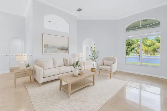 a spacious bedroom with a bed a couch and a potted plant