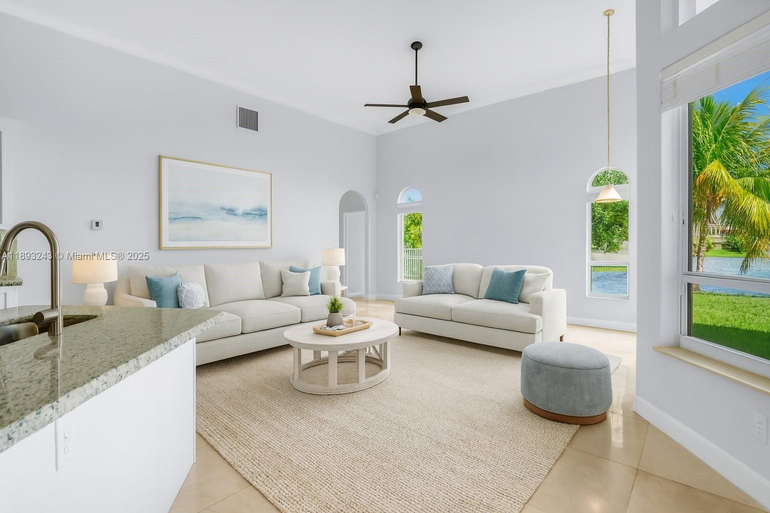 14032 Northwest 15th Street Pembroke Pines, FL 33028 - Photo 28 of 55 a living room with furniture and a large window