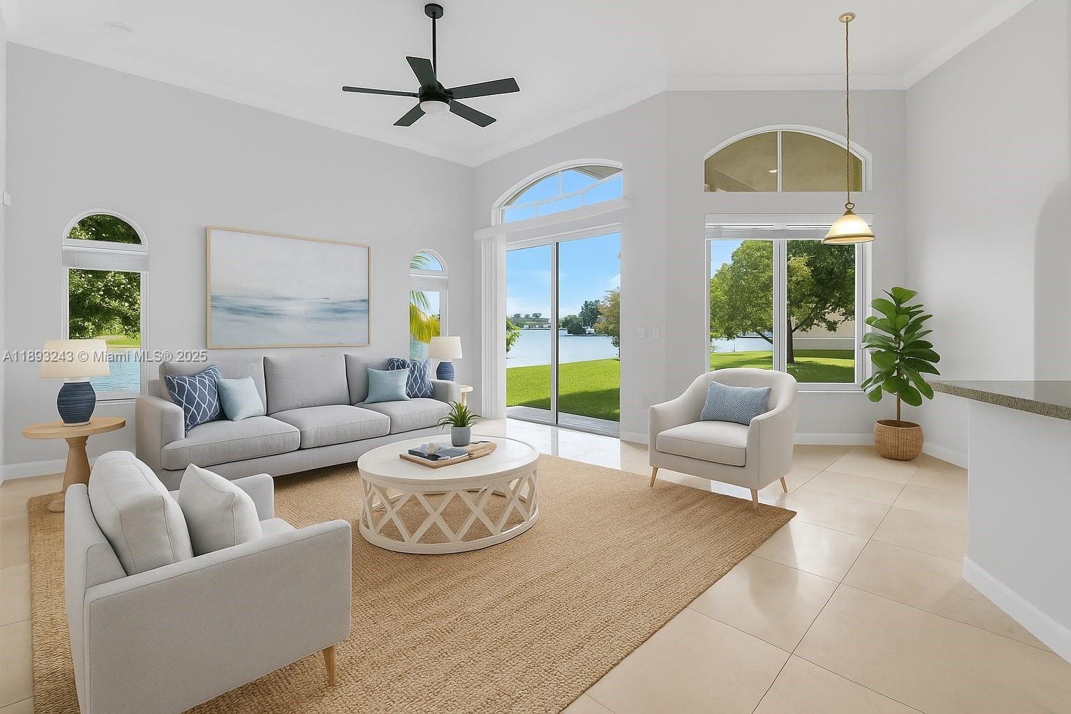 14032 Northwest 15th Street Pembroke Pines, FL 33028 - Photo 29 of 55 a living room with furniture a chandelier and a large window