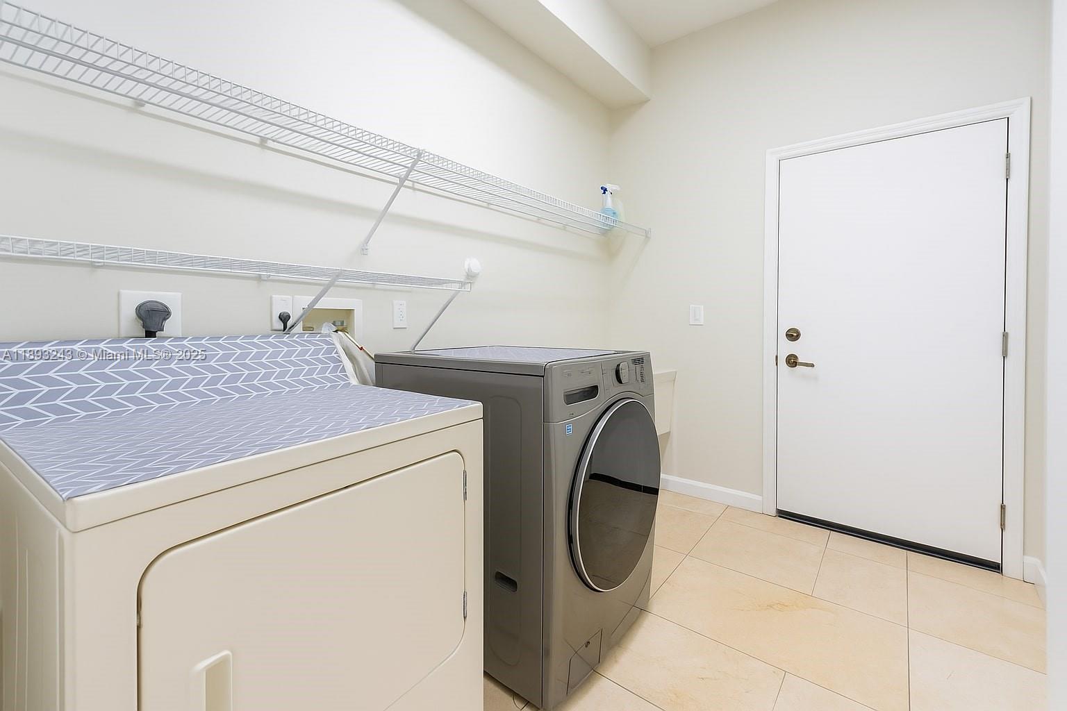 14032 Northwest 15th Street Pembroke Pines, FL 33028 - Photo 33 of 55 a utility room with dryer and washer