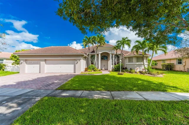 a front view of house with garden