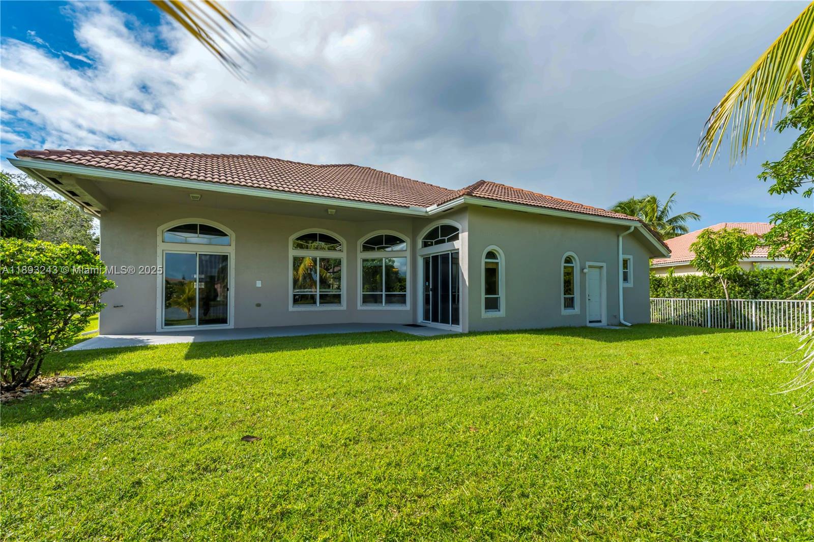 14032 Northwest 15th Street Pembroke Pines, FL 33028 - Photo 48 of 55 a front view of a house with garden