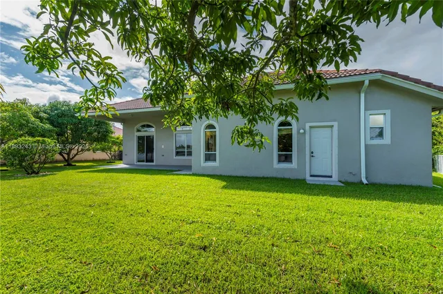 a view of a park with slide and a bench