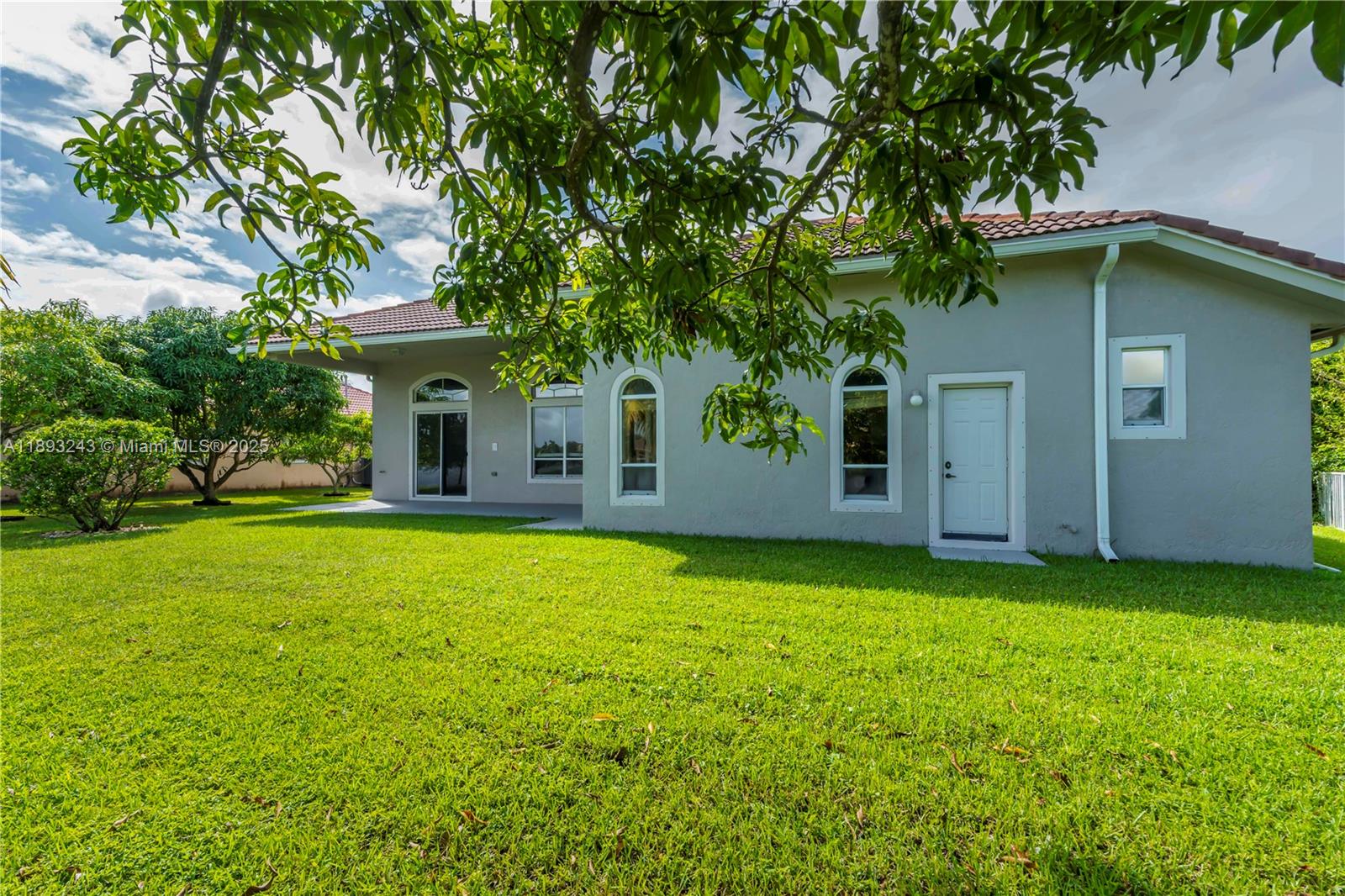 14032 Northwest 15th Street Pembroke Pines, FL 33028 - Photo 50 of 55 a front view of a house with a garden